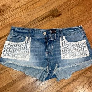 Hollister denim short shorts with white lace accent pockets, low rise, size 27